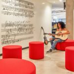 BuzziSpace Acoustic Cylindrical Sound-Absorbing Pouf Ottoman BuzziSpot acoustic pouf in an interior setting