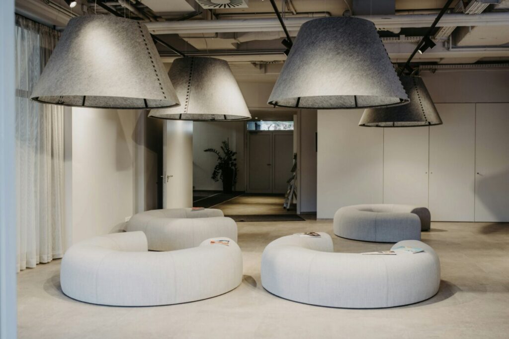 BuzziSpace Acoustic Upholstered C-Shaped Bench lifestyle view